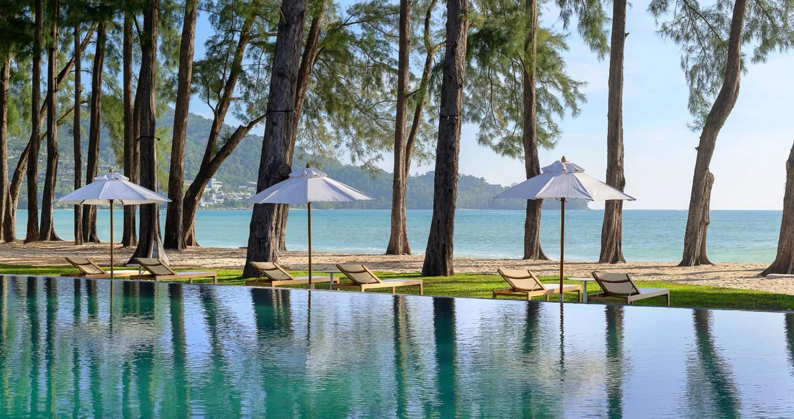 The beach pool of the InterContinental Phuket Resort under casuarina trees on Kamala Beach, the resort next door to The Residences at InterContinental Phuket Resort