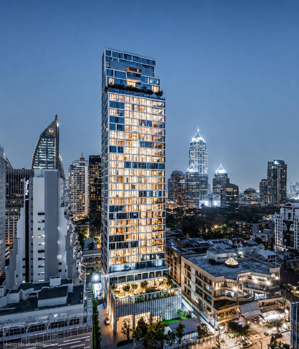 Scope Langsuan: the tower lit at dusk above the Langsuan and Lumphini skyline in central Bangkok